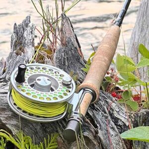 rod-reel-river-2-600 Fly rod and reel on river bank